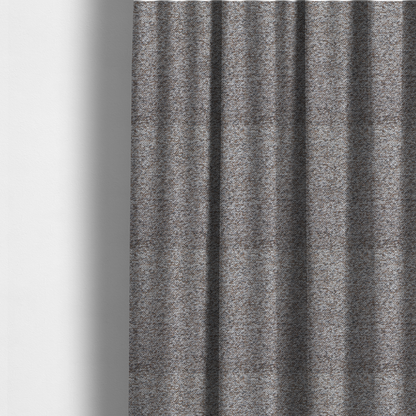 The fabric used to create these made-to-measure curtains is a dark charcoal and slate grey fabric with a dense, nubby weave. The heavy-duty, multi-tonal texture suggests a durable, high-quality material for furniture upholstery.