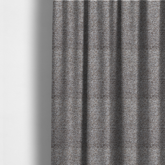 The fabric used to create these made-to-measure curtains is a dark charcoal and slate grey fabric with a dense, nubby weave. The heavy-duty, multi-tonal texture suggests a durable, high-quality material for furniture upholstery.