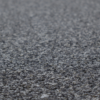 A textured, nubby fabric surface in shades of charcoal, slate, and light grey. The speckled pattern suggests a durable, tightly woven material, ideal for upholstery.