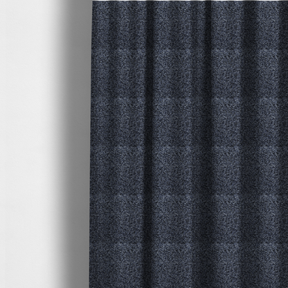The fabric used to create these made-to-measure curtains is a textured fabric surface. The material features a dense, nubby appearance with a speckled, multi-tonal colour palette of dark navy blue, charcoal, and light grey fibres, characteristic of heavy-duty carpeting or upholstery.