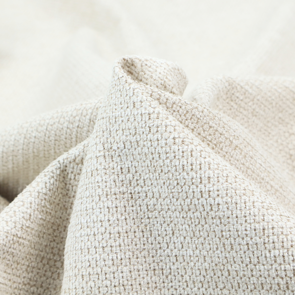 A warm cream or off-white tone. The material features a chunky, heavyweight weave with a distinct dimensional grid. The texture is composed of thick, interlaced threads that create a series of small, raised rectangular bumps, giving it a basket weave or bouclé-like appearance.