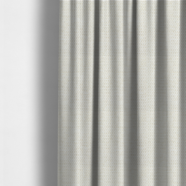 The fabric used to create these made-to-measure curtains is a warm cream or off-white tone. The material features a chunky, heavyweight weave with a distinct dimensional grid. The texture is composed of thick, interlaced threads that create a series of small, raised rectangular bumps, giving it a basket weave or bouclé-like appearance.