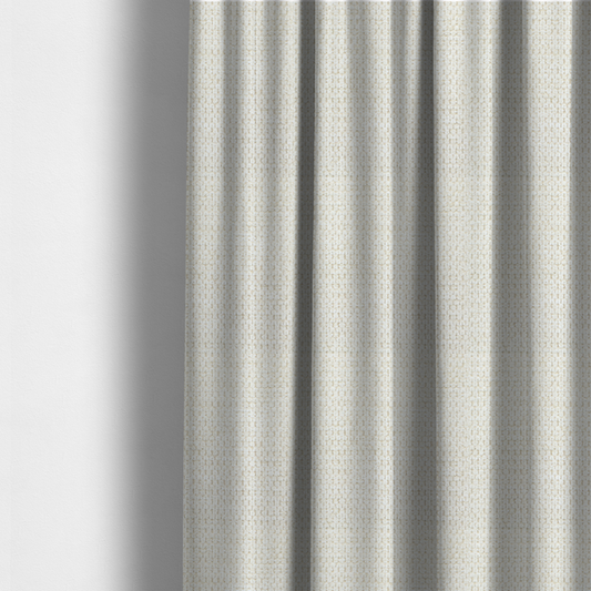 The fabric used to create these made-to-measure curtains is a warm cream or off-white tone. The material features a chunky, heavyweight weave with a distinct dimensional grid. The texture is composed of thick, interlaced threads that create a series of small, raised rectangular bumps, giving it a basket weave or bouclé-like appearance.