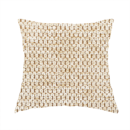 The fabric used to create this handmade cushion is a textured, multi-tonal beige and tan fabric. The material features a tight, intricate weave that creates a pebbled or "seed stitch" appearance. The colour is a warm sand or wheat palette, achieved by interlacing light cream threads with darker tan or straw-coloured fibres, giving the fabric a rich, organic depth.