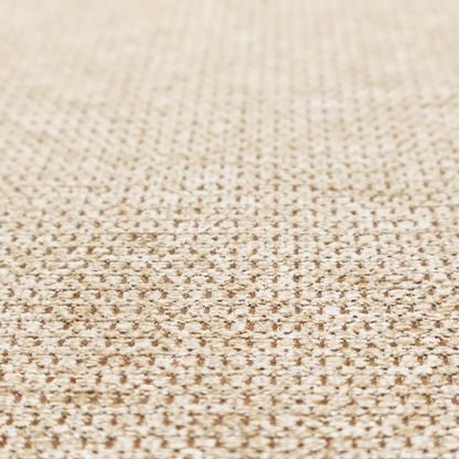 A textured, multi-tonal beige and tan fabric. The material features a tight, intricate weave that creates a pebbled or "seed stitch" appearance. The colour is a warm sand or wheat palette, achieved by interlacing light cream threads with darker tan or straw-coloured fibres, giving the fabric a rich, organic depth.