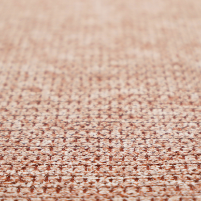 A textured, multi-tonal terracotta and cream fabric. The material features a dense, rhythmic weave that creates a speckled or "salt and pepper" effect. The colour is a warm, earthy copper palette, achieved by blending burnt orange or clay-coloured threads with lighter off-white fibres for a rich, weathered appearance.
