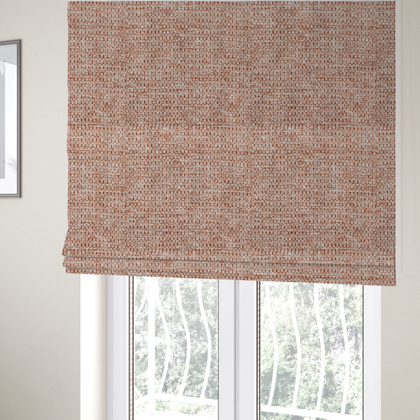 The fabric used to create these Roman blinds is a textured, multi-tonal terracotta and cream fabric. The material features a dense, rhythmic weave that creates a speckled or "salt and pepper" effect. The colour is a warm, earthy copper palette, achieved by blending burnt orange or clay-coloured threads with lighter off-white fibres for a rich, weathered appearance.