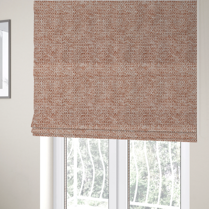 The fabric used to create these Roman blinds is a textured, multi-tonal terracotta and cream fabric. The material features a dense, rhythmic weave that creates a speckled or "salt and pepper" effect. The colour is a warm, earthy copper palette, achieved by blending burnt orange or clay-coloured threads with lighter off-white fibres for a rich, weathered appearance.