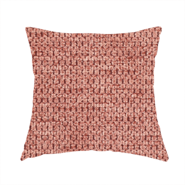 The fabric used to create this handmade cushion is a textured fabric in a muted rose or dusty clay tone. The material features a dense, rhythmic weave with a tactile, pebbled surface. The colour is a sophisticated, warm mauve, created by interlacing deep pinkish-brown threads with lighter rose fibres, giving it a weathered, multi-dimensional look.