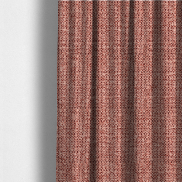 The fabric used to create these made-to-measure curtains is a textured fabric in a muted rose or dusty clay tone. The material features a dense, rhythmic weave with a tactile, pebbled surface. The colour is a sophisticated, warm mauve, created by interlacing deep pinkish-brown threads with lighter rose fibres, giving it a weathered, multi-dimensional look.