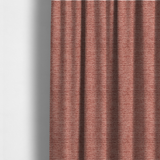 The fabric used to create these made-to-measure curtains is a textured fabric in a muted rose or dusty clay tone. The material features a dense, rhythmic weave with a tactile, pebbled surface. The colour is a sophisticated, warm mauve, created by interlacing deep pinkish-brown threads with lighter rose fibres, giving it a weathered, multi-dimensional look.