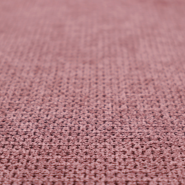 A textured fabric in a deep dusty rose or muted berry tone. The material features a tight, uniform weave with a distinct honeycomb-like structure. The colour is a rich, cool-toned mauve, achieved by blending darker plum threads with lighter pink fibres, creating a subtle weathered effect that adds depth and sophistication.
