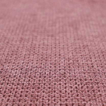 A textured fabric in a deep dusty rose or muted berry tone. The material features a tight, uniform weave with a distinct honeycomb-like structure. The colour is a rich, cool-toned mauve, achieved by blending darker plum threads with lighter pink fibres, creating a subtle weathered effect that adds depth and sophistication.