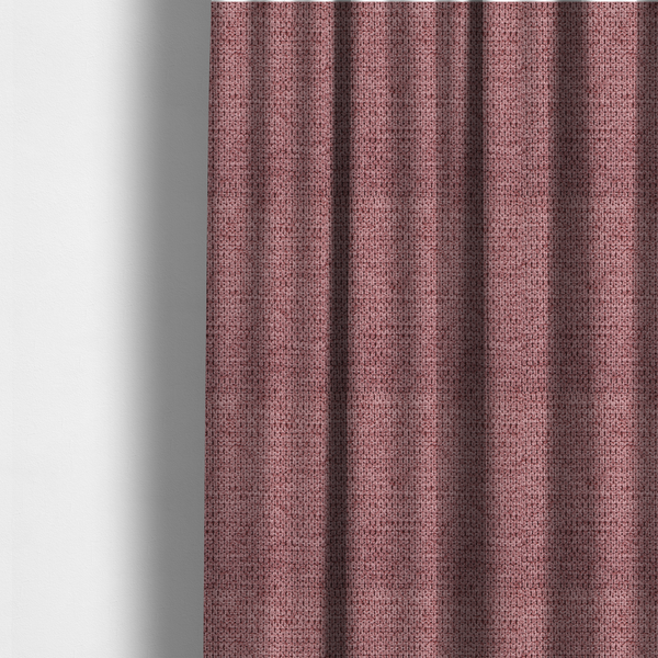 The fabric used to create these made-to-measure curtains is a textured fabric in a deep dusty rose or muted berry tone. The material features a tight, uniform weave with a distinct honeycomb-like structure. The colour is a rich, cool-toned mauve, achieved by blending darker plum threads with lighter pink fibres, creating a subtle weathered effect that adds depth and sophistication.