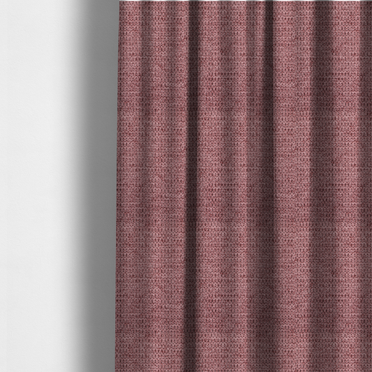 The fabric used to create these made-to-measure curtains is a textured fabric in a deep dusty rose or muted berry tone. The material features a tight, uniform weave with a distinct honeycomb-like structure. The colour is a rich, cool-toned mauve, achieved by blending darker plum threads with lighter pink fibres, creating a subtle weathered effect that adds depth and sophistication.