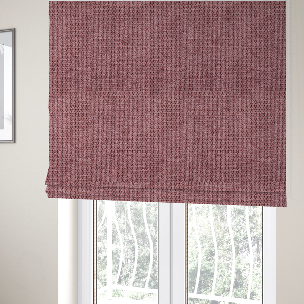 The fabric used to create these Roman blinds is a textured fabric in a deep dusty rose or muted berry tone. The material features a tight, uniform weave with a distinct honeycomb-like structure. The colour is a rich, cool-toned mauve, achieved by blending darker plum threads with lighter pink fibres, creating a subtle weathered effect that adds depth and sophistication.
