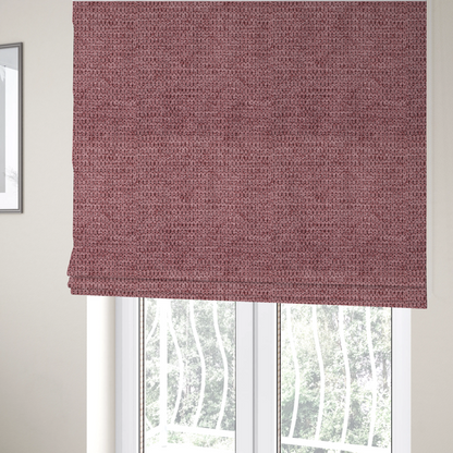 The fabric used to create these Roman blinds is a textured fabric in a deep dusty rose or muted berry tone. The material features a tight, uniform weave with a distinct honeycomb-like structure. The colour is a rich, cool-toned mauve, achieved by blending darker plum threads with lighter pink fibres, creating a subtle weathered effect that adds depth and sophistication.