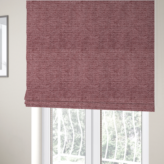 The fabric used to create these Roman blinds is a textured fabric in a deep dusty rose or muted berry tone. The material features a tight, uniform weave with a distinct honeycomb-like structure. The colour is a rich, cool-toned mauve, achieved by blending darker plum threads with lighter pink fibres, creating a subtle weathered effect that adds depth and sophistication.