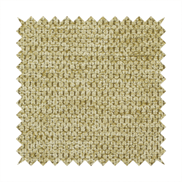 A textured fabric in a warm olive or golden-khaki tone. The material features a tight, rhythmic weave with a prominent tactile surface. The colour is a rich, earthy sage, achieved by interlacing olive-green threads with lighter tan and straw-coloured fibres, creating a weathered, organic look that shifts beautifully in the light.