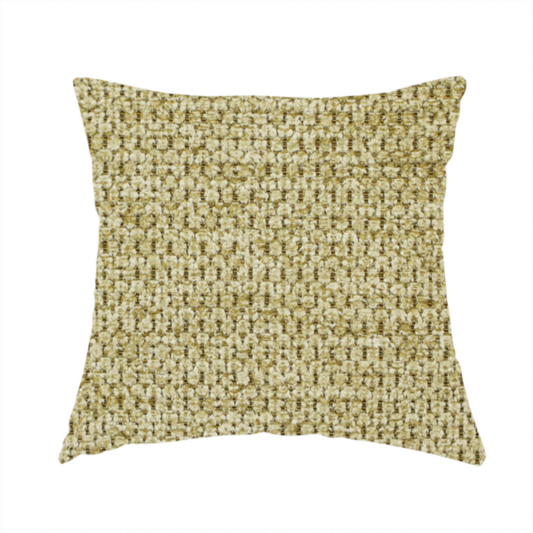 The fabric used to create this handmade cushion is a textured fabric in a warm olive or golden-khaki tone. The material features a tight, rhythmic weave with a prominent tactile surface. The colour is a rich, earthy sage, achieved by interlacing olive-green threads with lighter tan and straw-coloured fibres, creating a weathered, organic look that shifts beautifully in the light.