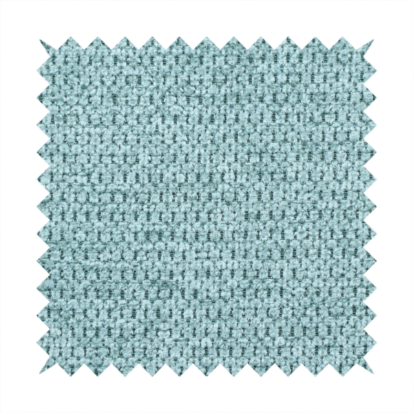 A textured fabric in a vibrant aqua or light teal tone. This material features a dense, rhythmic weave with a prominent tactile surface. The colour is a refreshing seafoam blue, achieved by interlacing bright aqua threads with subtle grey base fibres, creating a weathered, multidimensional look that feels energetic yet sophisticated.