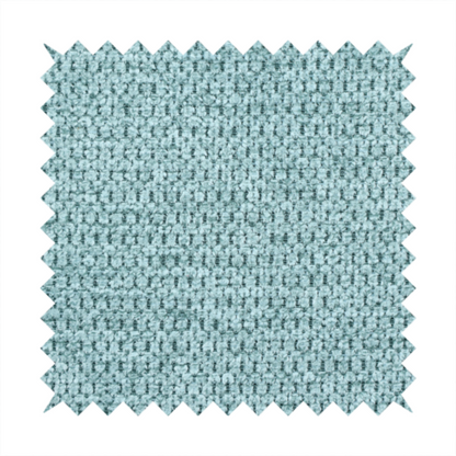 A textured fabric in a vibrant aqua or light teal tone. This material features a dense, rhythmic weave with a prominent tactile surface. The colour is a refreshing seafoam blue, achieved by interlacing bright aqua threads with subtle grey base fibres, creating a weathered, multidimensional look that feels energetic yet sophisticated.