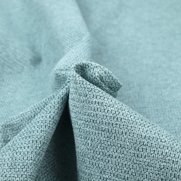 A textured fabric in a vibrant aqua or light teal tone. This material features a dense, rhythmic weave with a prominent tactile surface. The colour is a refreshing seafoam blue, achieved by interlacing bright aqua threads with subtle grey base fibres, creating a weathered, multidimensional look that feels energetic yet sophisticated.