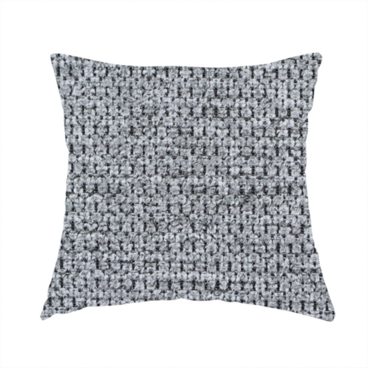 The fabric used to create this handmade cushion is a textured fabric in a classic charcoal or weathered grey. The material features a dense, rhythmic weave with a tactile, pebbled surface. The colour is a sophisticated mid-grey, achieved by interlacing silver-grey threads with darker black base fibres, creating a high-contrast, multidimensional look that feels balanced and durable.