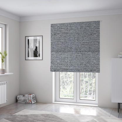The fabric used to create these Roman blinds is a textured fabric in a classic charcoal or weathered grey. The material features a dense, rhythmic weave with a tactile, pebbled surface. The colour is a sophisticated mid-grey, achieved by interlacing silver-grey threads with darker black base fibres, creating a high-contrast, multidimensional look that feels balanced and durable.
