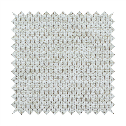 A textured fabric in light greige or pale oatmeal. The material features a dense, rhythmic honeycomb weave. The colour is achieved by interlacing light cream threads with cool grey base fibres, creating a neutral, stony appearance with a soft, pebbled tactile surface.