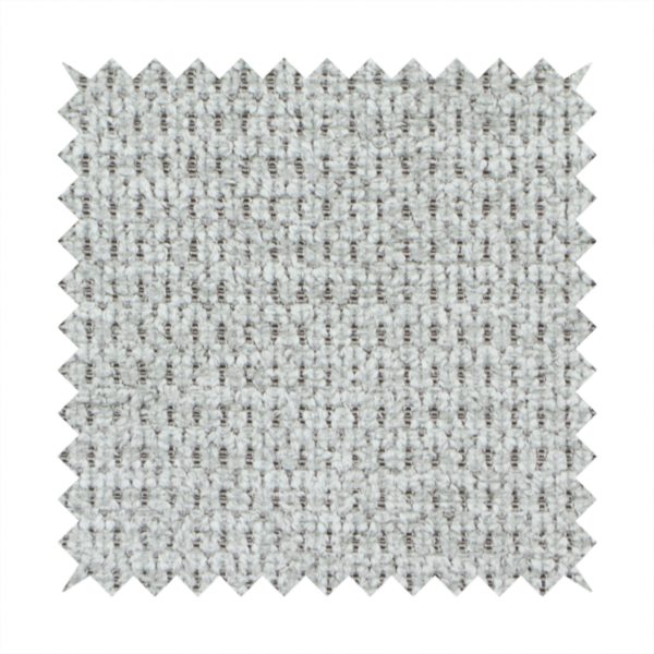 A textured fabric in a soft dove grey. This swatch features the signature uniform honeycomb weave, but with a lighter, more silver-toned profile than the previous neutral. The interlacing of white and light grey threads gives it a crisp, clean, and airy aesthetic.