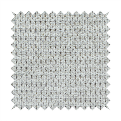 A textured fabric in a soft dove grey. This swatch features the signature uniform honeycomb weave, but with a lighter, more silver-toned profile than the previous neutral. The interlacing of white and light grey threads gives it a crisp, clean, and airy aesthetic.