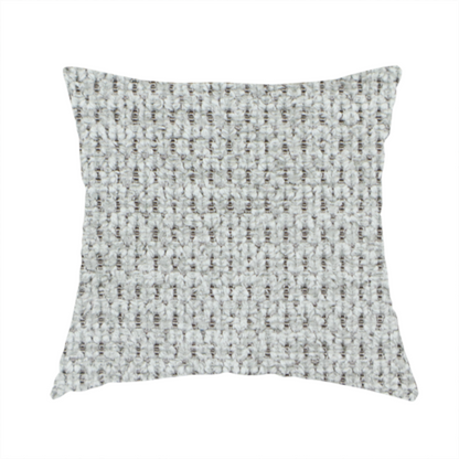 The fabric used to create this handmade cushion is a textured fabric in a soft dove grey. This swatch features the signature uniform honeycomb weave, but with a lighter, more silver-toned profile than the previous neutral. The interlacing of white and light grey threads gives it a crisp, clean, and airy aesthetic.