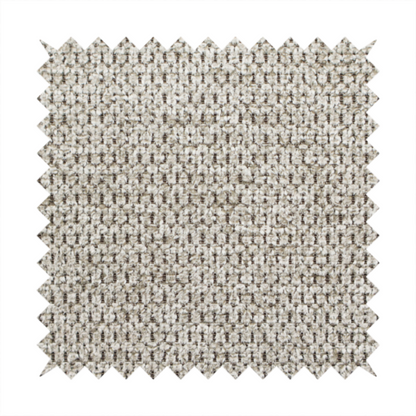 A textured fabric in a warm stone or soft taupe tone. This material features the collection's signature dense, rhythmic honeycomb weave. The colour is a sophisticated neutral mushroom, achieved by interlacing light cream and flax-coloured threads over a darker tan base, creating a grainy, organic depth that feels both earthy and modern.