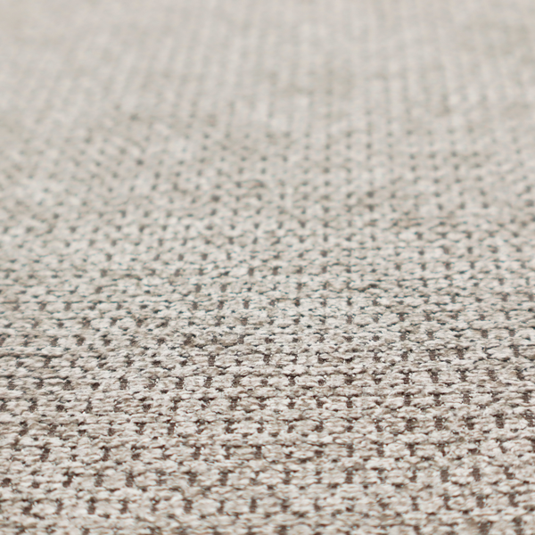 A textured fabric in a warm stone or soft taupe tone. This material features the collection's signature dense, rhythmic honeycomb weave. The colour is a sophisticated neutral mushroom, achieved by interlacing light cream and flax-coloured threads over a darker tan base, creating a grainy, organic depth that feels both earthy and modern.