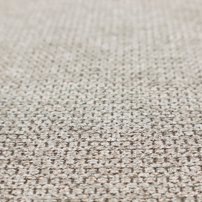 A textured fabric in a warm stone or soft taupe tone. This material features the collection's signature dense, rhythmic honeycomb weave. The colour is a sophisticated neutral mushroom, achieved by interlacing light cream and flax-coloured threads over a darker tan base, creating a grainy, organic depth that feels both earthy and modern.