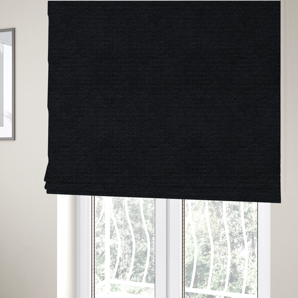 The fabric used to create these Roman blinds is a textured fabric in midnight black. This swatch represents the deepest tone in the collection, featuring a uniform, tight waffle-weave. The monochromatic black threads create a subtle play of shadow within the geometric grid, offering a sleek, architectural aesthetic.
