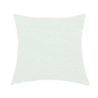 The fabric used to create these handmade cushions is a pale off-white or cream-colored fabric featuring a fine, subtle grid-like texture. The weave consists of horizontal and vertical threads that create a soft, matte finish with a minimalist, clean aesthetic.