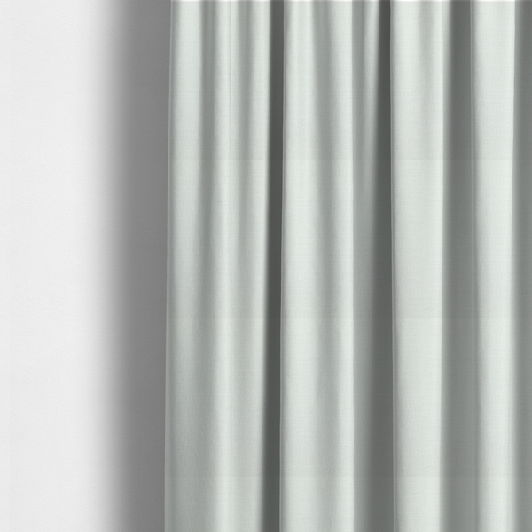 The fabric used to create these made-to-measure curtains is a pale off-white or cream-colored fabric featuring a fine, subtle grid-like texture. The weave consists of horizontal and vertical threads that create a soft, matte finish with a minimalist, clean aesthetic.
