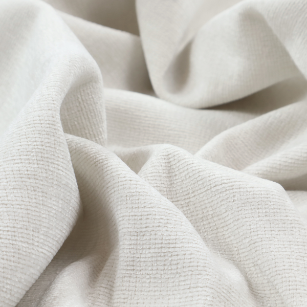 A off-white fabric with a prominent horizontal ribbed texture. The weave features thicker, raised cream threads that create a subtle striped effect on a matte, textured surface, ideal for modern interior design.