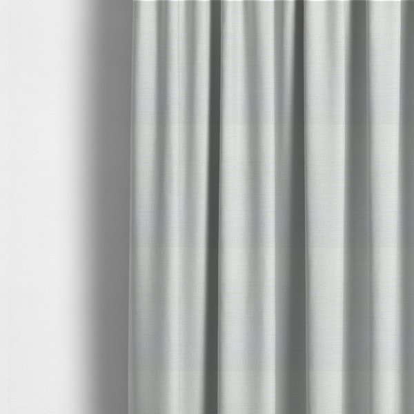 The fabric used to create these made-to-measure curtains is a off-white fabric with a prominent horizontal ribbed texture. The weave features thicker, raised cream threads that create a subtle striped effect on a matte, textured surface, ideal for modern interior design.