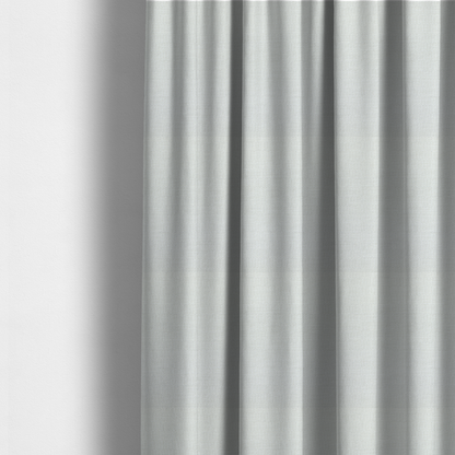 The fabric used to create these made-to-measure curtains is a off-white fabric with a prominent horizontal ribbed texture. The weave features thicker, raised cream threads that create a subtle striped effect on a matte, textured surface, ideal for modern interior design.