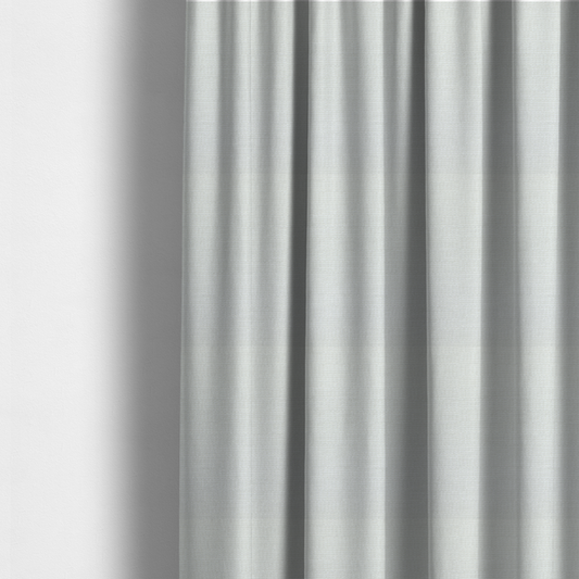 The fabric used to create these made-to-measure curtains is a off-white fabric with a prominent horizontal ribbed texture. The weave features thicker, raised cream threads that create a subtle striped effect on a matte, textured surface, ideal for modern interior design.