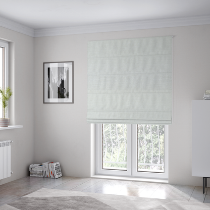 The fabric used to create these Roman blinds is a off-white fabric with a prominent horizontal ribbed texture. The weave features thicker, raised cream threads that create a subtle striped effect on a matte, textured surface, ideal for modern interior design.
