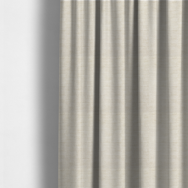 The fabric used to create these made-to-measure curtains is a warm beige or oatmeal-coloured fabric featuring a dense, horizontal corded texture. The weave has a soft, chenille-like appearance with closely packed raised lines, creating a cosy and high-tactile surface.