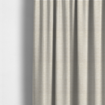The fabric used to create these made-to-measure curtains is a warm beige or oatmeal-coloured fabric featuring a dense, horizontal corded texture. The weave has a soft, chenille-like appearance with closely packed raised lines, creating a cosy and high-tactile surface.