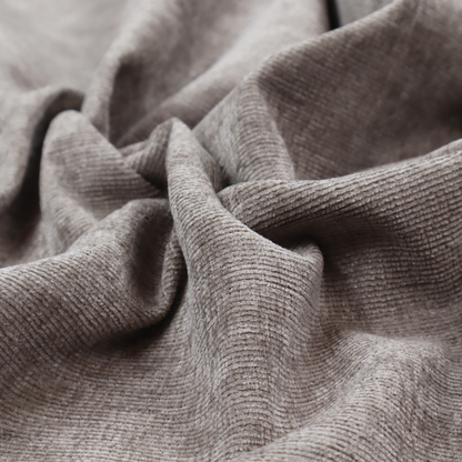 A taupe or ash brown fabric with a dense, horizontal ribbed texture. The material features a soft, velvety pile that creates subtle light-catching highlights and shadows across the linear weave.