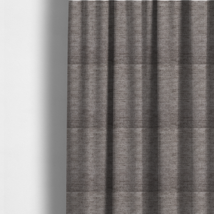The fabric used to create these made-to-measure curtains is a taupe or ash brown fabric with a dense, horizontal ribbed texture. The material features a soft, velvety pile that creates subtle light-catching highlights and shadows across the linear weave.