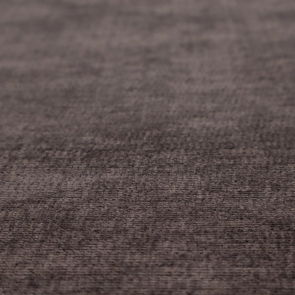 A deep charcoal or cocoa-brown fabric with a heavy horizontal corded texture. The dense, linear weave creates a multi-tonal effect with subtle shadows, offering a sophisticated and cosy tactile appearance.