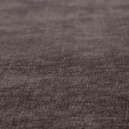 A deep charcoal or cocoa-brown fabric with a heavy horizontal corded texture. The dense, linear weave creates a multi-tonal effect with subtle shadows, offering a sophisticated and cosy tactile appearance.